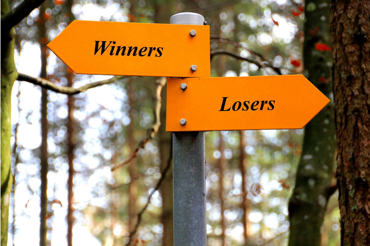 Sign with two arrows one pointing left for winners and one pointing right for losers