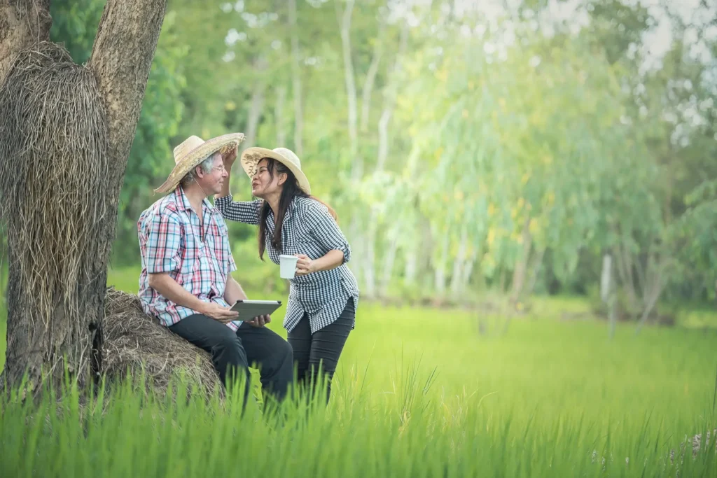 couple on vacation laughing in Asian countryside