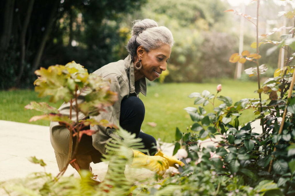 woman kneeling in garden