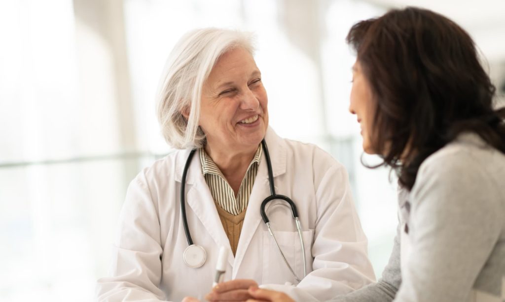 female doctor nearing retirement speaking to a patient