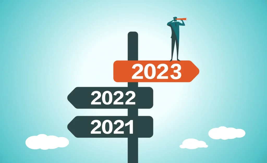 animated graphic of a person standing on a 2023 sign looking toward the future. below that are signs of 2021 and 2022 pointing to the past.