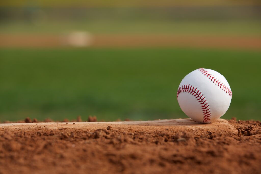 close up of a baseball on a pitchers mound looking towards second base.